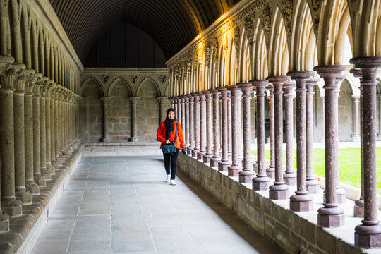 woman walking around the monastery of Mont St. Michel