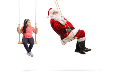 Santca claus and a girl swinging on wooden swings
