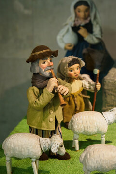 Wooden painted figurine of a shepherd with sheep. 