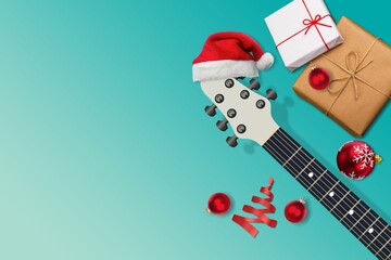 Composition with guitar and Santa hat. Christmas music