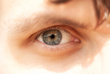 Staring eye of young man close up