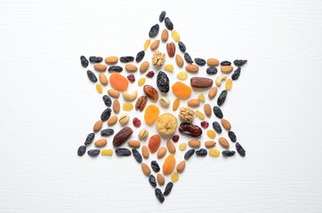 Mix of dried fruits and nuts - symbols of judaic holiday Tu Bishvat. Star of David .
