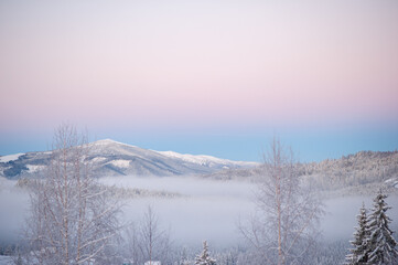 winter sunrise landscape with snow in the mountains