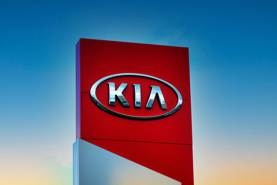 Kiev, Ukraine - July 08, 2020. Kia company's sign on sky bakcground, Kia is a South Korean multinational automobile manufacturer