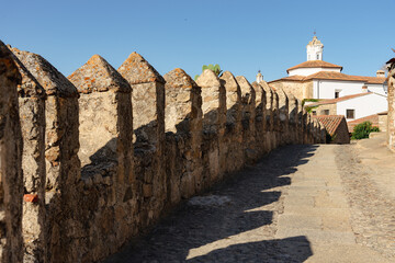 Fototapeta na wymiar Defensive walls beside the narrow cobbled streets of the medieval city of Trujillo, Caceres, Extremadura, Spain
