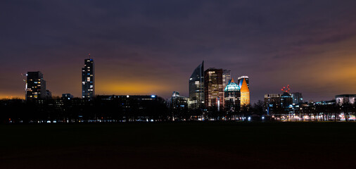 Skyline of the city of The Hague, Netherlands at night, as seen from park Malieveld in the centre...