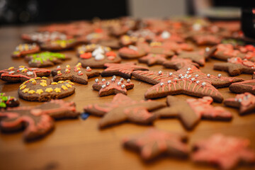 Colorful gingerbread cookies on wooden table 