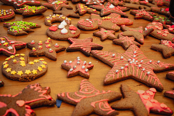 Colorful gingerbread cookies on wooden table 