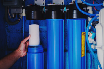 Water filter system or osmosis, Replacing the water filter, water-purification. Commercial use. Selective focus. © surasak