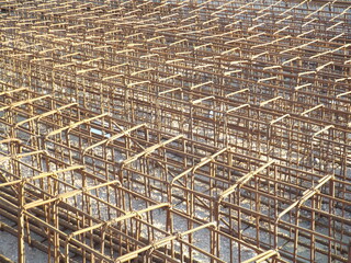 Irons on a construction site in the sun.
Rusty metal rods for reinforced concrete under sunlight.
Construction material for metal structures.