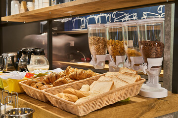 Cereals, bread and croissants in the breakfast area