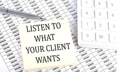 LISTEN TO WHAT YOUR CLIENT WANTS - business concept, message on sticker on chart background