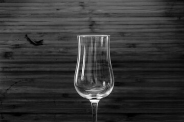 Transparent drinking glass on brown wooden old table with white backround