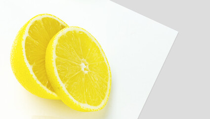Fresh organic yellow lemon fruit slice on white background.