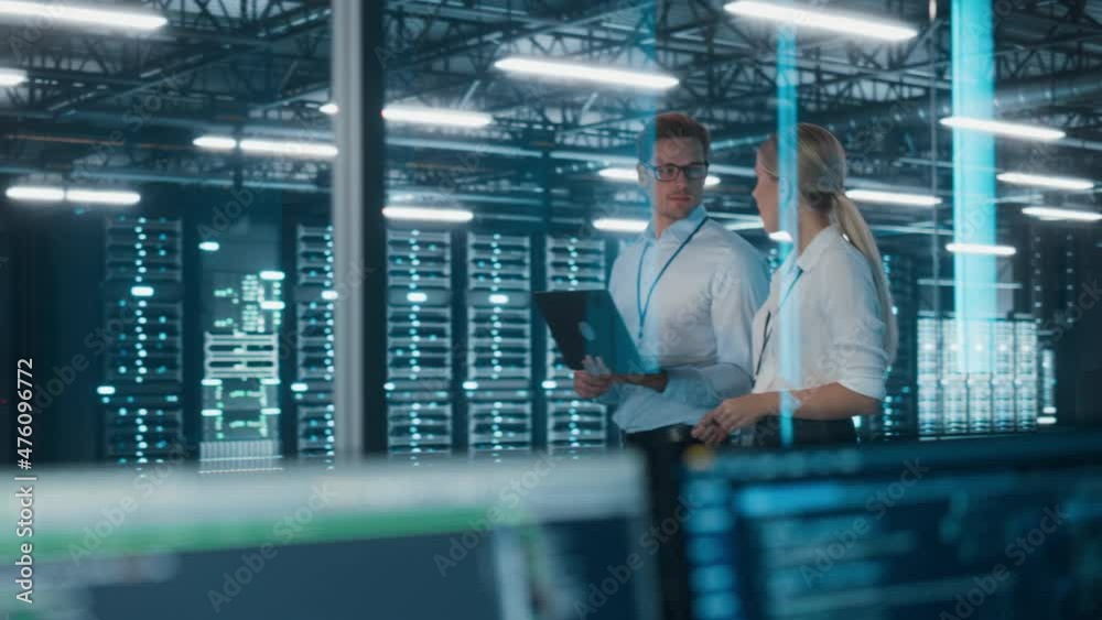 Aufkleber Data Center Server Room: Female e-Business Enrepreneur and Male IT Specialist talk, Use Laptop, Walk. Information Technology Engineer and System Administrator work on Web Services Cloud Computing SAAS