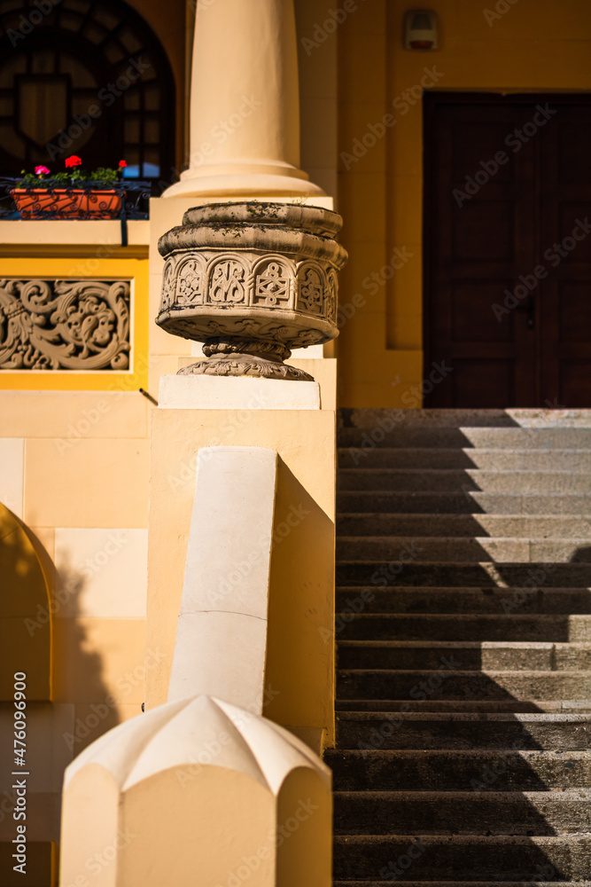 Poster vertical shot of a of architectural details of elegant facade building