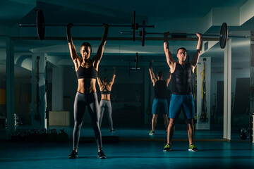 Fototapeta na wymiar A workout couple training in the gym