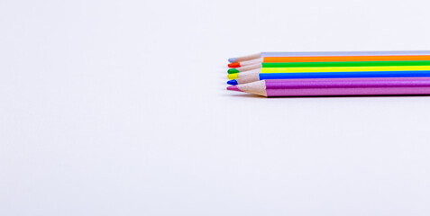 colored pencils lie on a white background. pencils of different colors. wooden pencils