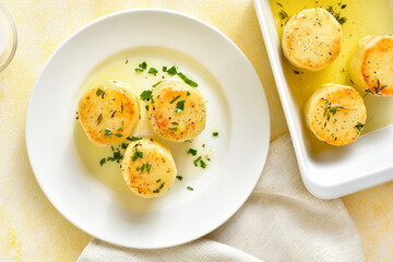 Fondant potatoes on plate