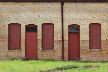 Close-up Building Detail Historical Brick Wall With Doors and Windows