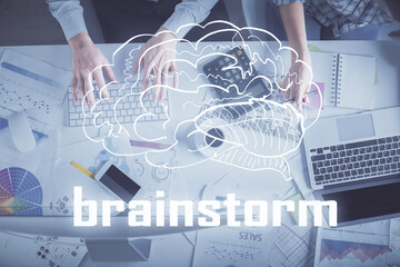 Double exposure of man and woman working together and creative hologram drawing. Computer background. Top View. Start up concept.