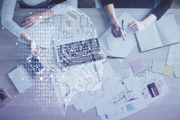 Double exposure of woman working on computer andhuman brain hologram drawing. Top View. Ai concept.