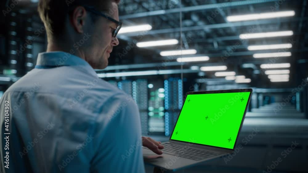 Poster High-Tech Data Center Server Room: IT Specialist System Administrator Working on Green Screen Chroma Key Laptop Computer. Monitoring Web Services, Cloud Computing, Cyber Security Protection