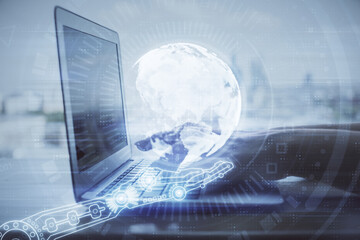 Double exposure of woman hands working on computer and world map hologram drawing. International technology business concept.