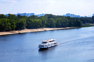 Fototapeta na wymiar The ship goes along the Dnieper river in the city of Kiev