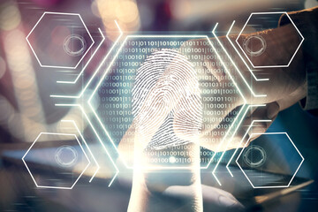 Double exposure of man's hands holding and using a digital device and fingerprint hologram drawing. Security concept.