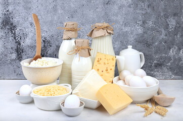 Assorted fresh dairy products, healthy breakfast with ingredients, natural nutrition concept, maintaining healthy intestinal microflora, diet food, rustic table, selective approach