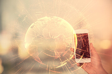 Obraz premium Double exposure of social network sketch hologram and woman holding and using a mobile device.