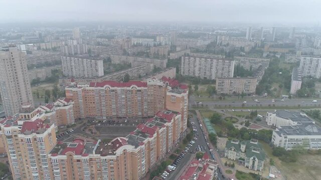 After rain. Cityscape in fog. Obolon district in Kyiv city, Ukraine. Aerial. 