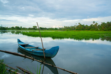 Blue color Wooden fishing boat - Backwaters photography, Kerala Backwaters, Kerala backwaters photography during day time Kadamakkudy Kerala