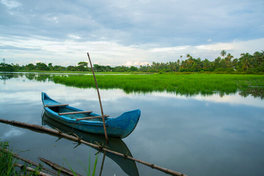 Blue color Wooden fishing boat - Backwaters photography, Kerala Backwaters, Kerala backwaters photography during day time Kadamakkudy Kerala