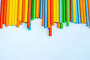 stack of colorful wooden sticks for kids. sticks for counting, minusing and pulsing numbers. learn and play, for childrens. eco toys. plus, minus educational game. space for text.