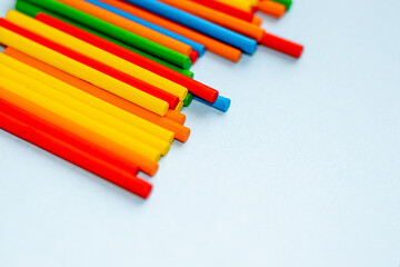 stack of colorful wooden sticks for kids. sticks for counting, minusing and pulsing numbers. learn and play, for childrens. eco toys. plus, minus educational game. space for text.
