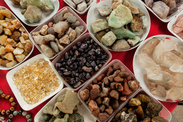 Precious stones in separate containers for sale on the street market of Bangkok, Thailand