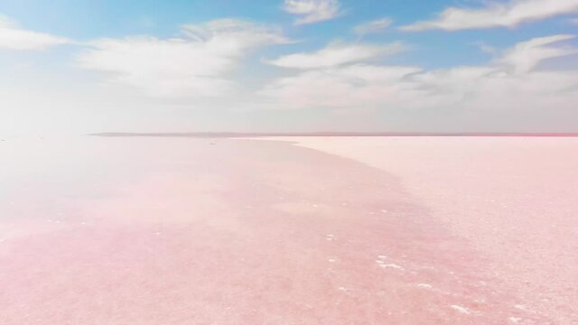 Aerial rising view close up pink Tuz salt lake in Turkey . Tuz golu panoramic landscape in central anatolia