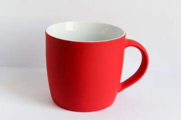 Blank red mug isolated on white background,mat tea or coffee cup,mock up with ceramic mug for hot drinks,empty gift print branding template,tankard for design,placement for logo,christmas decoration.
