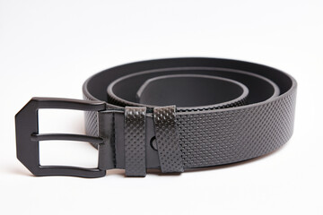 Big black leather belt with black metal buckle.