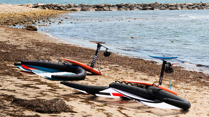 Two kite surfing boards and sail on the shore in Narraganssett Rhode Island