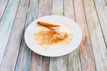 Rice pudding is a typical multi-country dessert that is made by slowly cooking rice pudding and sugar. It is usually sprinkled with cinnamon, vanilla, or lemon peel for flavor.