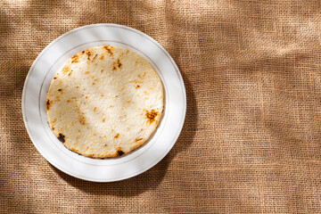 Arepa of ground corn - Traditional Colombian food