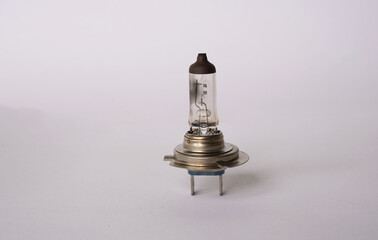 Halogen light bulb that is mainly used for headlights on a car. This picture shows a bulb that is blown and no longer works. You can clearly see the filament broken. 