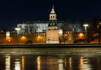 Fototapeta na wymiar Moscow, Russia. Night view of Blagoveschenskaya Tower of The Moscow Kremlin. Embankment. December