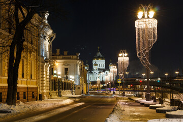 Fototapeta na wymiar Moscow, Russia. Night view of Sofiyskaya embankment. Crist The Saviour catherdral. Winter. December