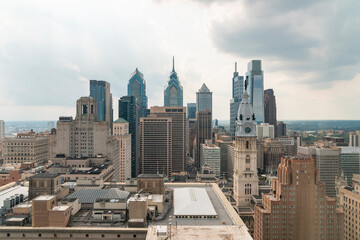 Aerial panoramic cityscape of Philadelphia financial downtown, Pennsylvania, USA. Philadelphia City Hall Clock Tower at summer day time. A vibrant business and cultural neighborhoods.