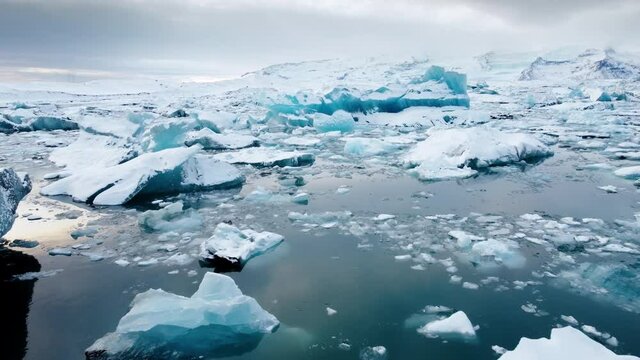 Icebergs from melting glacier in ice lagoon. Majestic Arctic Deep Clear Water. Climate Change Global Warming problem. Iceland.
