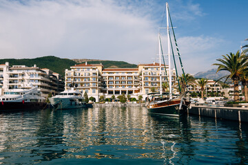 Fototapeta na wymiar Sailing yachts at the marina of the Regent Hotel in Porto. Montenegro